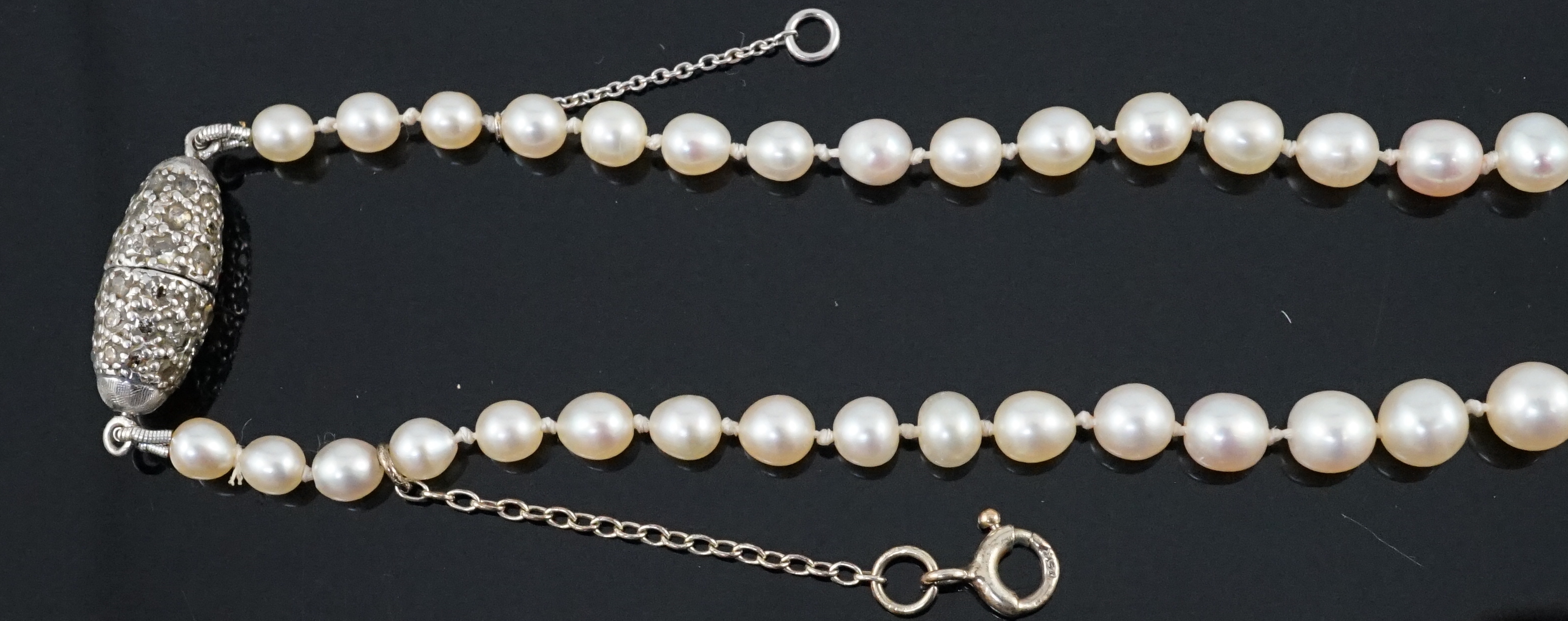 A single strand graduated natural saltwater pearl necklace, with AnchorCert report dated 31st March, 2023, with diamond set torpedo shaped clasp